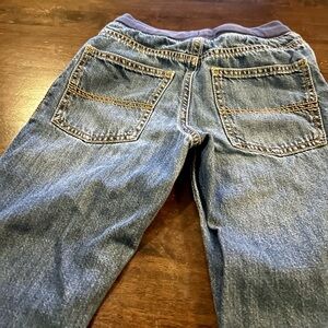 THREE pairs of Carters jeans size 7.